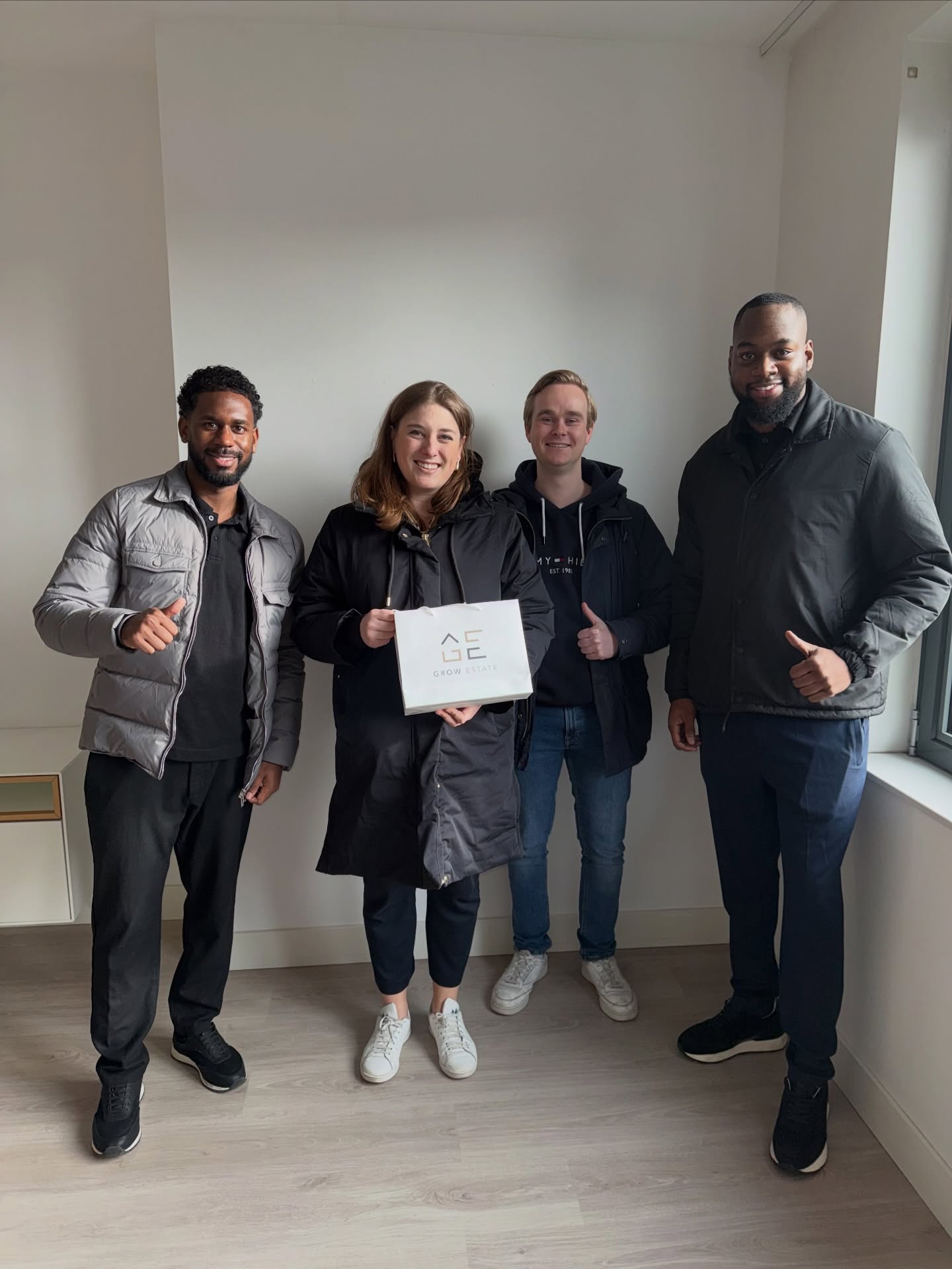 Grow Estate klanten na een succesvolle aankoop met Denzel en Jairo